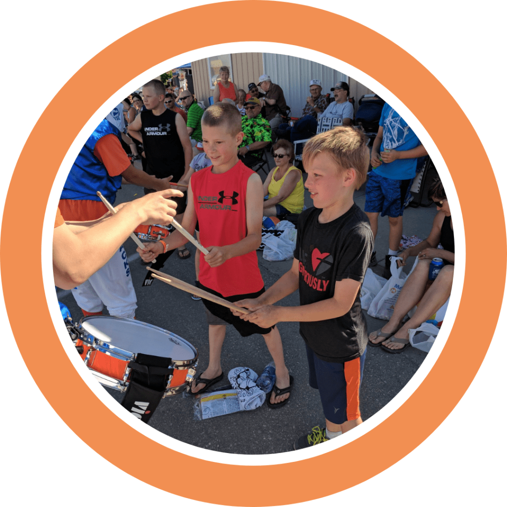 The Kracker Jacks Drumline letting kids play their drums